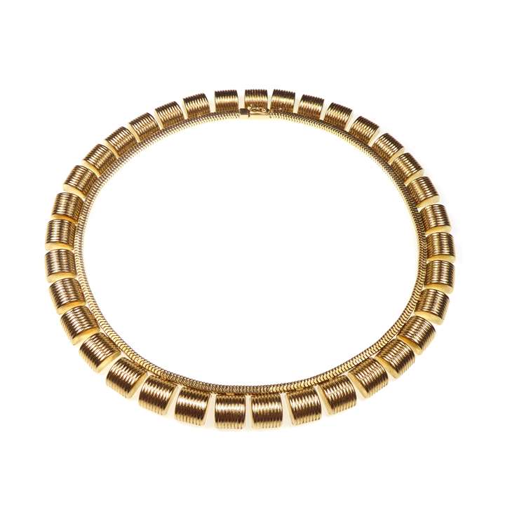 Gold retro fringe necklace hung with reeded arch panels
